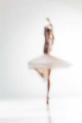 Image showing Blurred silhouette of ballerina on white background