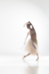 Image showing Blurred silhouette of ballerina on white background