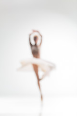 Image showing Blurred silhouette of ballerina on white background