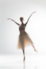 Image showing Blurred silhouette of ballerina on white background