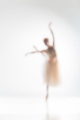 Image showing Blurred silhouette of ballerina on white background