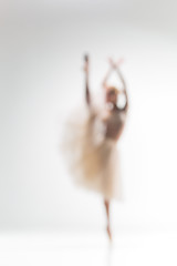 Image showing Blurred silhouette of ballerina on white background