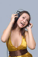 Image showing Cheering girl with headphones