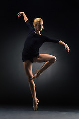 Image showing Young beautiful modern style dancer posing on a studio background