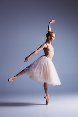 Image showing Young beautiful modern style dancer posing on a studio background