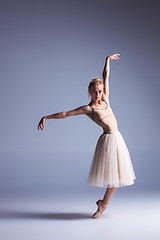 Image showing Young beautiful modern style dancer posing on a studio background