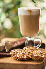 Image showing coffee latte cup with cookies