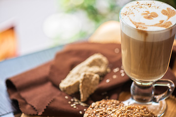 Image showing coffee latte cup with cookies