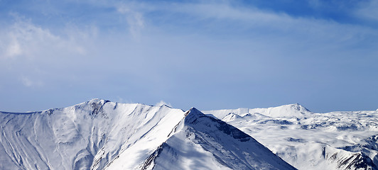 Image showing Panoramic view on snowy mountains at sunny day