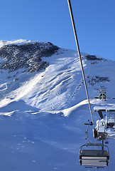 Image showing Off-piste slope and chair-lift after snowfall