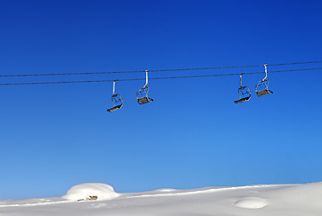 Image showing Chair-lift and blue clear sky at sunny day