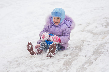 Image showing Girl with snow-covered rolling hills