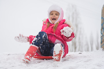 Image showing Girl shouting and rejoicing rolling ice slides