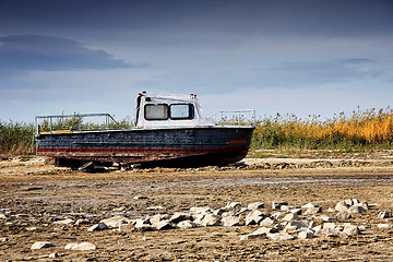 Image showing Dried lake with some boats