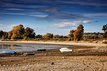 Image showing Dried lake with some boats