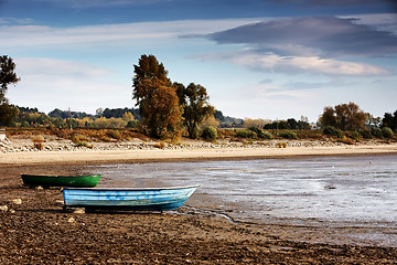 Image showing Dried lake with some boats