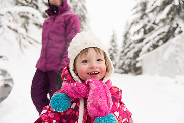 Image showing little girl at snowy winter day