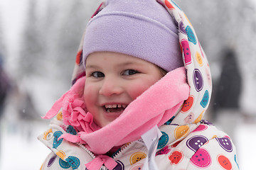 Image showing little girl at snowy winter day