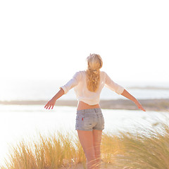 Image showing Free Happy Woman Enjoying Sun on Vacations.