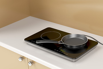 Image showing Double induction cooktop and frying pan