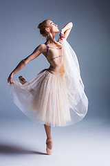 Image showing Young beautiful ballerina dancer dancing on a studio background