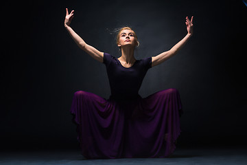 Image showing Young beautiful modern style dancer posing on a studio background