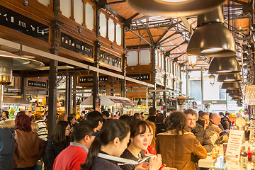 Image showing People drinking and eating at San Miguel market, Madrid.