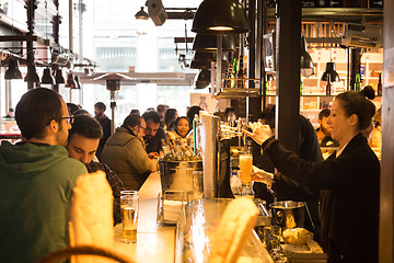 Image showing People drinking and eating at San Miguel market, Madrid.