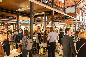 Image showing People drinking and eating at San Miguel market, Madrid.