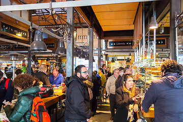 Image showing People drinking and eating at San Miguel market, Madrid.