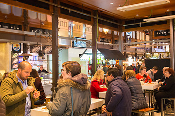 Image showing People drinking and eating at San Miguel market, Madrid.