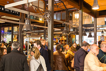 Image showing People drinking and eating at San Miguel market, Madrid.