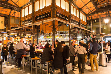 Image showing People drinking and eating at San Miguel market, Madrid.