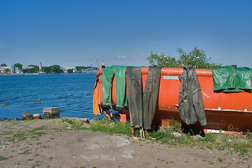 Image showing Fishing boat with wet sailor uniform. Baltiysk