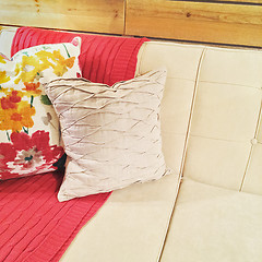 Image showing Sofa with pink throw and cushions