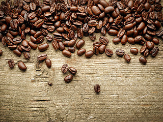 Image showing coffee beans on wooden table