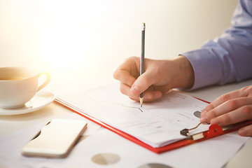 Image showing The male hand drawing a graph of growth