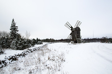 Image showing Old windmill in a snowy landscape