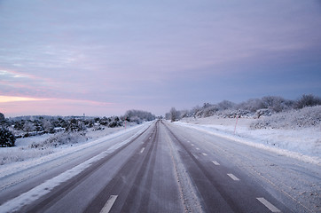 Image showing Snowy asphalt country road