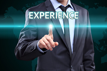 Image showing business, internet and networking concept - businessman pressing experience button on virtual screens