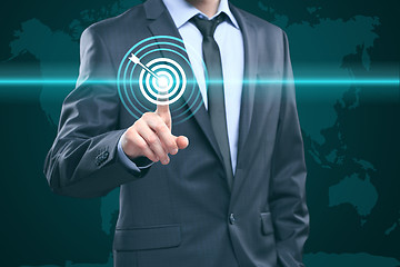 Image showing business, technology, internet and networking concept - businessman pressing button with contact on virtual screens. World map