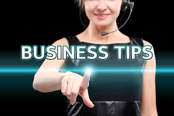 Image showing businesswoman, Focus on hand pressing Business Tips button. virtual screens, technology, internet concept. 