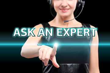 Image showing businesswoman, Focus on hand pressing Ask an expert button. virtual screens, technology, internet concept. 