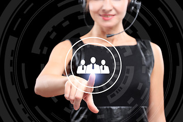 Image showing business, technology and internet concept - businesswoman pressing sign matching people button on virtual screens