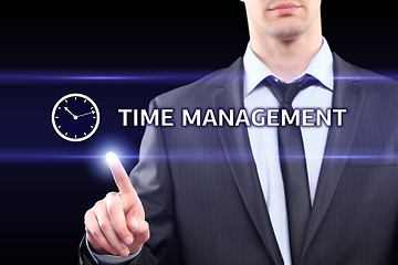 Image showing business, technology, networking concept - businessman pressing time management button on virtual screens