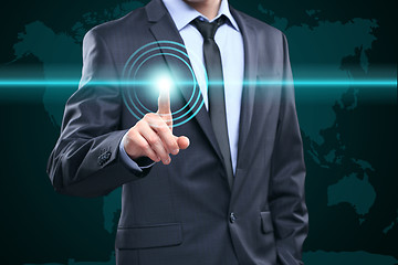 Image showing business, technology, internet and networking concept - businessman pressing button with contact on virtual screens. World map