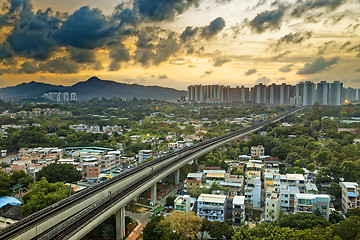 Image showing hong kong urban downtown and sunset speed train, Long Ping