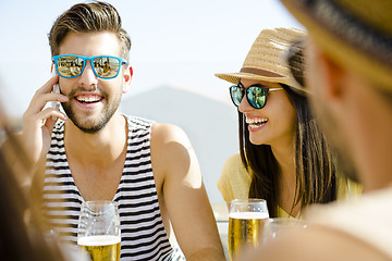 Image showing Friends at the beach bar