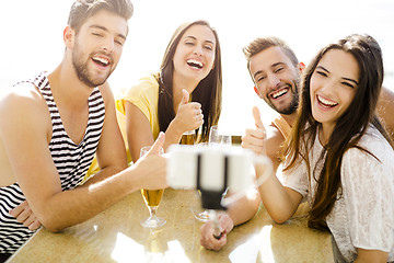 Image showing Group selfie at the beach bar