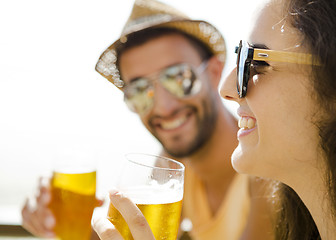 Image showing Friends drinking a cold beer